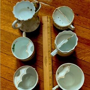 Antique moustache and shaving mugs. One with original shaving brush